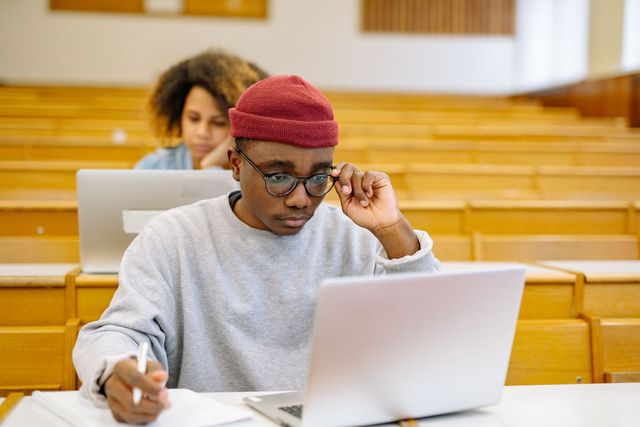 Students working on laptops during an intensive training session